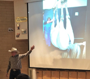 Veterinarian giving slide presentation