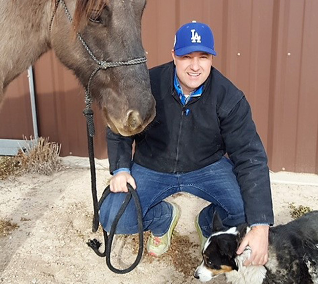 Paul astride a mule in cool weather